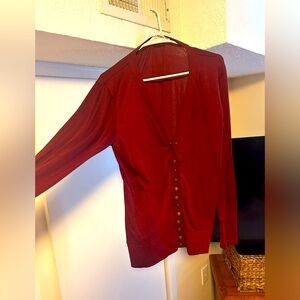Super cute deep red cardigan with gold snaps. XL and thin material.